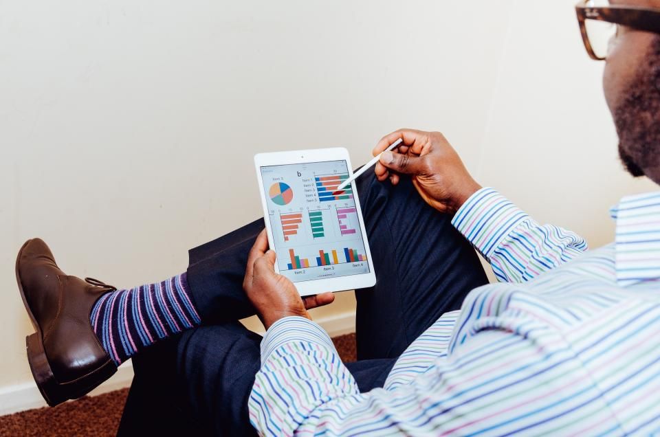 Tablet showing a chart on a boardroom table
