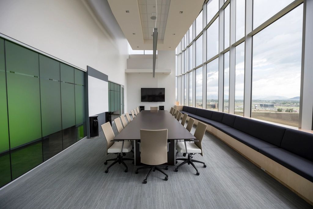 An empty boardroom with a long table